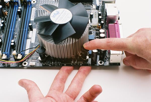 Buttoning down the heatsink over the CPU